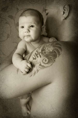 newborn baby on father's handsの写真素材