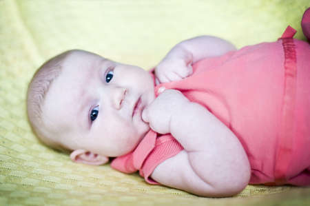 Infant baby on the yellow plaid 