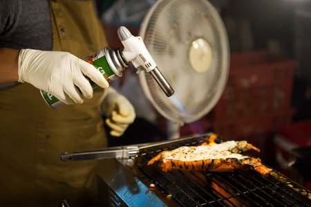 People buy some traditional food and drinks on the night market in Thailand, Phuket in high tourist...