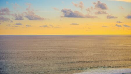 Beautiful view of the sunset on the beach from the cliffの写真素材