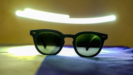 Close up sunglasses on the tableの写真素材