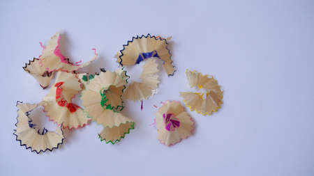 Close up of colored pencil shavings with a white backgroundの写真素材