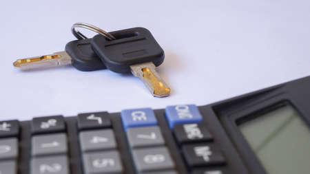 Close up key and calculatorの写真素材