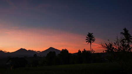 Beautiful views of the sunrise in the tropical countrysideの写真素材
