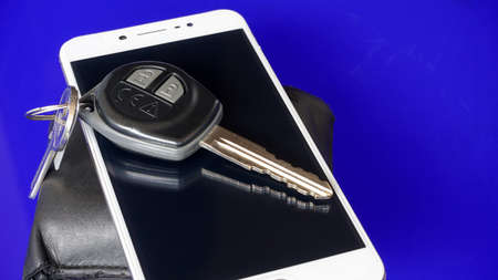 Close up cellphone and car keyの写真素材