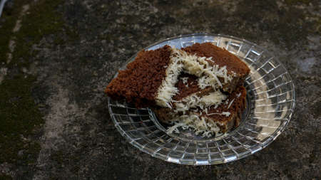 Close up of sliced chocolate cake with cheese toppingの写真素材