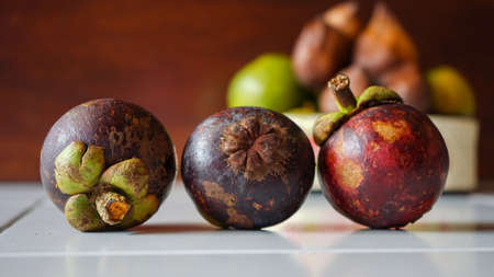 Close up of the mangosteen fruit on the tableの写真素材