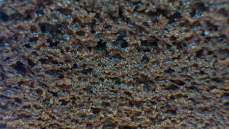 Close up of sliced chocolate cake with cheese toppingの写真素材