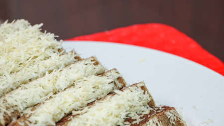 Close up of sliced chocolate cake with cheese toppingの写真素材