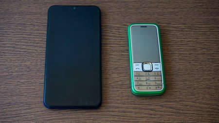 Close up of mobile phone on tableの写真素材