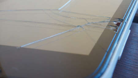 Close up of mobile phone on tableの写真素材