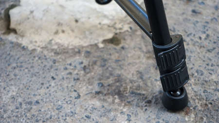 Close up part of camera tripodの写真素材