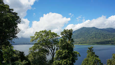 Mountain landscape with dense tropical forest and beautiful lakeの写真素材