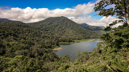 Mountain landscape with dense tropical forest and beautiful lakeの写真素材