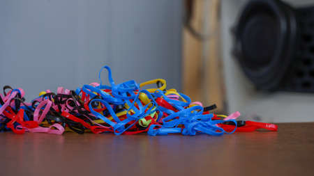 Close-up of colorful rubber bands on the tableの写真素材
