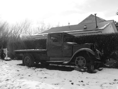 This balck and white picture was taken in El Calafate, Patagonia in Southern Argentina. One of the wheels is on a block with it's tire taken off. The sun's rays are also visibleの写真素材