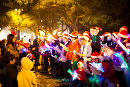 Hong Kong, China - December 24, 2010: Christmas carolers at Nathan road, a group of musician playing christmas songs at nightのeditorial素材