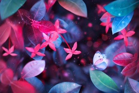 Fantastic summer tropical colorful butterfly, flowers and leaves. Bright natural spring summer ultra image. Ultraviolet, pink, red, blue and aquamarine color.の写真素材