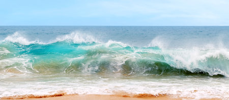 Blue and aquamarine color sea waves and yellow sand with white foam. Marine beach background. Banner...