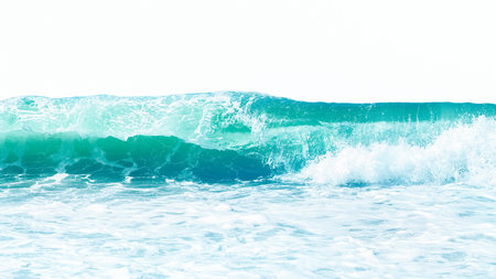 Powerful sea blue and aquamarine waves with white foam isolated on a white background.の写真素材