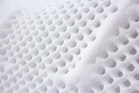 Wire mesh texture on the grid after a heavy snowfall