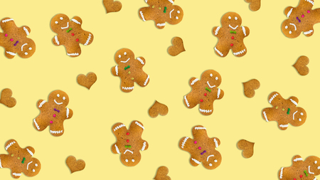 Christmas cookies and hearts on yellow background