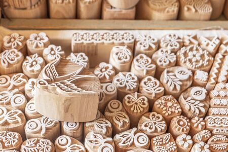 Wood printing blocks. Stamp for application drawing. Patterns on wooden surface of mold blocks for traditional printing textile.の写真素材