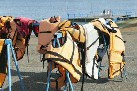 Life jackets on the shore. Safety boat trips