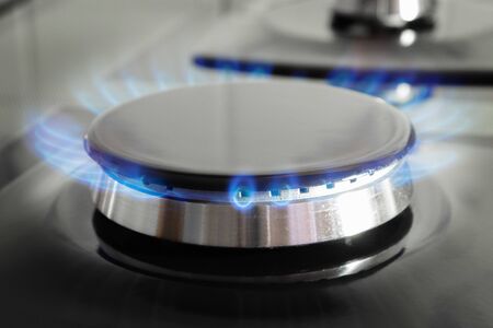 Gas stove burner with open fire close up