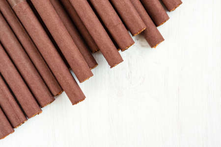Cigarettes in brown paper on a white background close-up. Top view.の写真素材