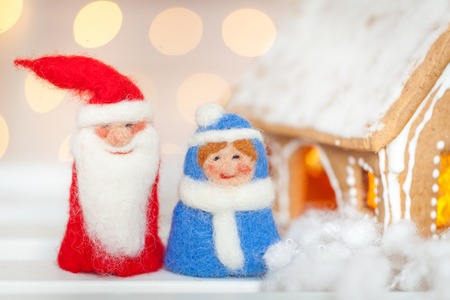 Felt christmas toys and homemade gingerbread houseの写真素材