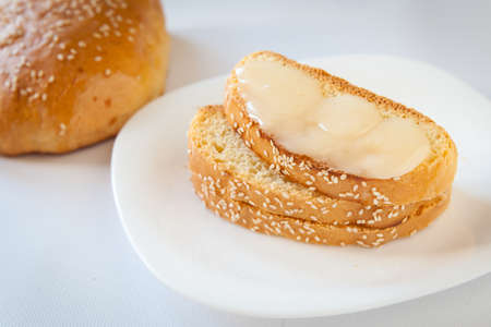 Healthy breakfast. Homemade bread with sesame spread with cream honey