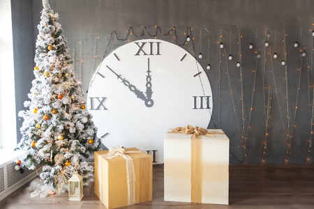 Christmas studio decor with huge clocks and presents. New year backgroundの写真素材