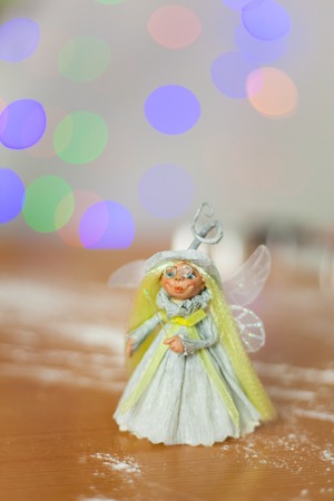 Little fairy in front of Christmas lightsの写真素材