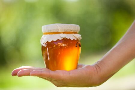 Jar with gold honeyの写真素材