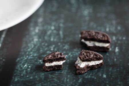 Chocolate cookies with cream fillingの写真素材