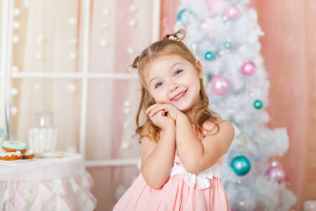 Cute girl in a Christmas decorationsの写真素材