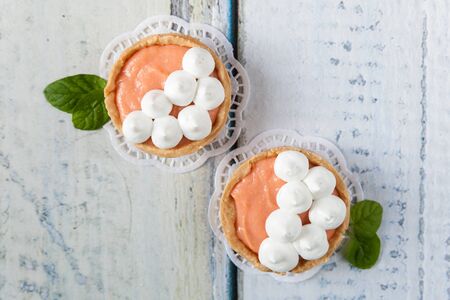 French tartlets with grapefruit curd and merengue on topの写真素材