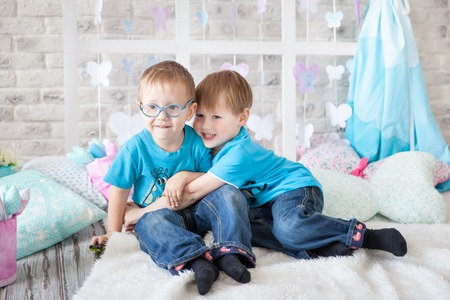 Cute brothers in a gentle pastel spring decorの写真素材