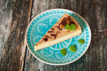 Healthy cheesecake on turquoise plate. Healthy home baking cake without sugar, proper nutrition, diet, dessert for weight lossの写真素材