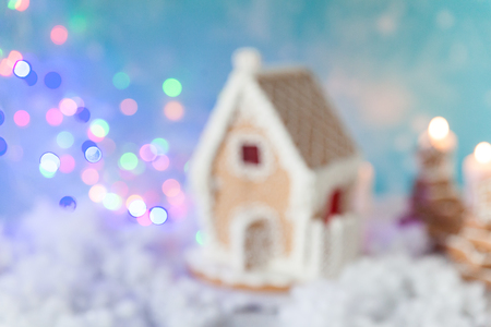 Blurred image of gingerbread house and gingerbread trees on a festive Christmas backgroundの写真素材