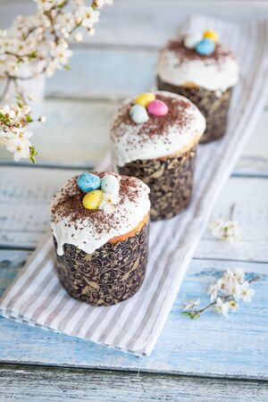 Easter cake kulich. Traditional Easter sweet bread decorated with sugar glaze and candy cane shape...