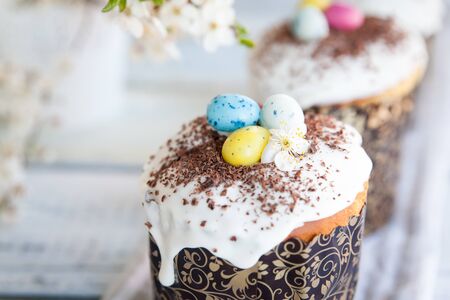 Easter cake kulich. Traditional Easter sweet bread decorated with sugar glaze and candy cane shape...