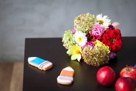 Back to school details. gingerbread pencils, apples and flowersの写真素材