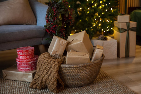Warm New Year's and Christmas interior. Basket with holiday presentsの写真素材