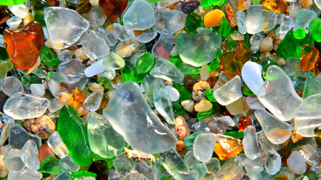 colorful glass pebbles on the beach, closeup of photoの写真素材