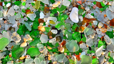 colorful glass pebbles on the beach, closeup of photoの写真素材