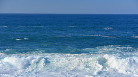 Seascape with waves breaking on the shore of the Atlantic Ocean.の写真素材