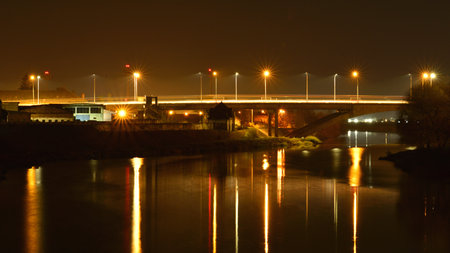 Night view of the bridge over the river in Targu Mures, Transylvania.の写真素材