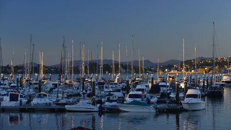 Boats and yachts in the marina at sunset. Baiona, Galicia.の写真素材